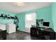Laundry room with washer, dryer, dark floor, shelves, desk and a large window at 6624 Lakestone Ct, Indianapolis, IN 46237