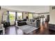 Inviting living room offers view of an eat-in kitchen and large windows providing great views at 6624 Lakestone Ct, Indianapolis, IN 46237