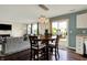 Open floor plan with dining area, sliding glass doors to deck, and view of living room at 6624 Lakestone Ct, Indianapolis, IN 46237