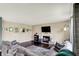 Comfortable living room features cozy seating, hardwood floors, and a fireplace for a warm atmosphere at 6624 Lakestone Ct, Indianapolis, IN 46237