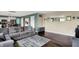 Spacious living room features stylish furniture, rug and seamless transition to kitchen and dining at 6624 Lakestone Ct, Indianapolis, IN 46237