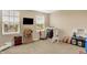 An empty room with tons of natural light that would work as a playroom at 6624 Lakestone Ct, Indianapolis, IN 46237