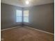 Comfortable bedroom with neutral carpet, offering a peaceful retreat with ample natural light at 6625 Wolverine Way, Indianapolis, IN 46237
