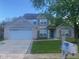 Charming two-story brick home with a well-manicured lawn and attached two car garage at 6625 Wolverine Way, Indianapolis, IN 46237