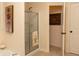 Bathroom featuring a walk-in shower with glass door and elegant decor at 665 Featherstone Dr, Westfield, IN 46074