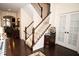 Welcoming foyer features hardwood floors, a staircase with white spindles, and elegant decor at 665 Featherstone Dr, Westfield, IN 46074