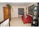 Welcoming upstairs landing with comfortable seating and charming decor at 665 Featherstone Dr, Westfield, IN 46074