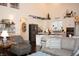 Open-concept living space with an eat-in kitchen featuring modern appliances and hardwood floors at 665 Featherstone Dr, Westfield, IN 46074