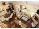 Open-concept living area with hardwood floors, fireplace, and eat-in kitchen with island at 665 Featherstone Dr, Westfield, IN 46074