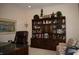 Well-decorated office space with built-in bookshelf, leather chair, and ample natural light at 665 Featherstone Dr, Westfield, IN 46074