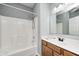 A bathroom featuring a single sink vanity with dark wood cabinets and a shower-tub combo at 6816 Park Square Dr # C, Avon, IN 46123