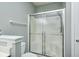 Close up of a bathroom featuring a glass door shower, gray walls and a white toilet at 6816 Park Square Dr # C, Avon, IN 46123