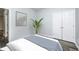 Simple bedroom with white comforter, neutral walls, and closet for storage at 6816 Park Square Dr # C, Avon, IN 46123