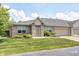 Charming single-story home with brick and siding, well-manicured lawn, and attached garage at 6816 Park Square Dr # C, Avon, IN 46123