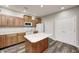 Kitchen with stainless steel appliances, island, and abundant wooden cabinetry at 6816 Park Square Dr # C, Avon, IN 46123