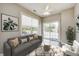 Comfortable living room featuring a gray couch, ample natural light, and a sliding glass door to outdoor living space at 6816 Park Square Dr # C, Avon, IN 46123