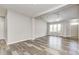 Open-concept living room showcasing hardwood floors, recessed lighting, and modern ceiling fan at 6816 Park Square Dr # C, Avon, IN 46123