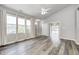 Spacious living room with hardwood floors, large windows, and open floor plan at 6816 Park Square Dr # C, Avon, IN 46123
