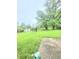 Lush backyard featuring mature trees, a playground, and storage shed at 7109 Chandler Dr, Indianapolis, IN 46217