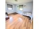 Bedroom with hardwood floors, two windows, and neutral paint creating a cozy atmosphere at 7109 Chandler Dr, Indianapolis, IN 46217