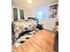 Bedroom with hardwood floors, natural light, and modern decor offering a cozy retreat at 7109 Chandler Dr, Indianapolis, IN 46217