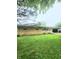 Well-maintained brick ranch home with a lush green lawn at 7109 Chandler Dr, Indianapolis, IN 46217