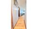 Hallway with natural wood trim provides seamless transitions to living spaces and bedrooms at 7109 Chandler Dr, Indianapolis, IN 46217
