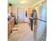 Kitchen with wooden cabinets, stainless steel appliances, and tiled backsplash at 7109 Chandler Dr, Indianapolis, IN 46217