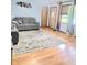 Inviting living room featuring hardwood floors, a large window, and stylish furniture at 7109 Chandler Dr, Indianapolis, IN 46217