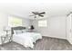 Bedroom features carpet, a ceiling fan, and windows providing lots of natural light at 7118 Mikesell Dr, Indianapolis, IN 46260
