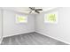 Inviting bedroom with natural light, updated ceiling fan, and soft gray carpeting at 7118 Mikesell Dr, Indianapolis, IN 46260