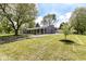 Ranch home featuring mature trees, a long driveway, and an attached garage at 7118 Mikesell Dr, Indianapolis, IN 46260