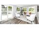 Cozy living room with lots of natural light, contemporary furniture, and hardwood floors at 7118 Mikesell Dr, Indianapolis, IN 46260