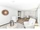 Bright living room with hardwood floors, natural lighting, and contemporary design at 7118 Mikesell Dr, Indianapolis, IN 46260
