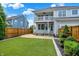A two-story house that has artificial turf, a privacy fence and a second story porch at 7614 Bishops, Zionsville, IN 46077