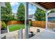 Backyard featuring a manicured yard, turf, wooden fence and exterior patio heater at 7614 Bishops, Zionsville, IN 46077