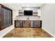 Modern bar area with custom cabinets, stainless steel appliances, and wine storage at 7614 Bishops, Zionsville, IN 46077