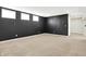 Large basement featuring neutral carpeting and dark accent wall at 7614 Bishops, Zionsville, IN 46077
