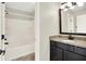 Bathroom vanity with granite countertops paired with a tub offering a functional and stylish space at 7614 Bishops, Zionsville, IN 46077