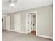 Bedroom featuring a fan, neutral colored walls, and a bathroom, creating a comfortable retreat at 7614 Bishops, Zionsville, IN 46077