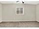 Cozy bedroom with neutral walls and carpet; window included at 7614 Bishops, Zionsville, IN 46077