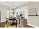 Eat-in dining area with hardwood floors, an archway view to the living room and a round table at 7614 Bishops, Zionsville, IN 46077