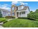 Inviting two-story home with a blend of stone and siding plus manicured landscaping at 7614 Bishops, Zionsville, IN 46077