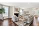 Bright living room featuring a cozy fireplace, hardwood floors and neutral decor at 7614 Bishops, Zionsville, IN 46077