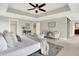 Spacious main bedroom with sitting area, ceiling fan, and ensuite bathroom with barn door entry at 7614 Bishops, Zionsville, IN 46077