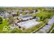 Aerial view of a spacious community pool surrounded by green trees and lovely homes at 7614 Bishops, Zionsville, IN 46077