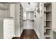 This beautiful walk-in closet features custom wood shelving and lots of space at 7614 Bishops, Zionsville, IN 46077
