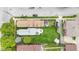 Aerial view of the property, featuring a spacious backyard with a well-kept lawn, storage shed, and outdoor patio at 767 Fletcher Ave, Indianapolis, IN 46203