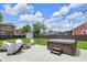 Backyard showcasing a fire pit, patio, seating and hot tub at 767 Fletcher Ave, Indianapolis, IN 46203