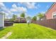 Spacious, well-maintained backyard with lush green grass, privacy fence and hot tub at 767 Fletcher Ave, Indianapolis, IN 46203